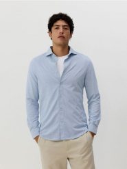 Koszula slim fit w paski - jasnoniebieski. Niebieskie koszule damskie Reserved, l, bez wzorów, z bawełny, bez kołnierzyka, bez ramiączek. Za 89.99 zł.