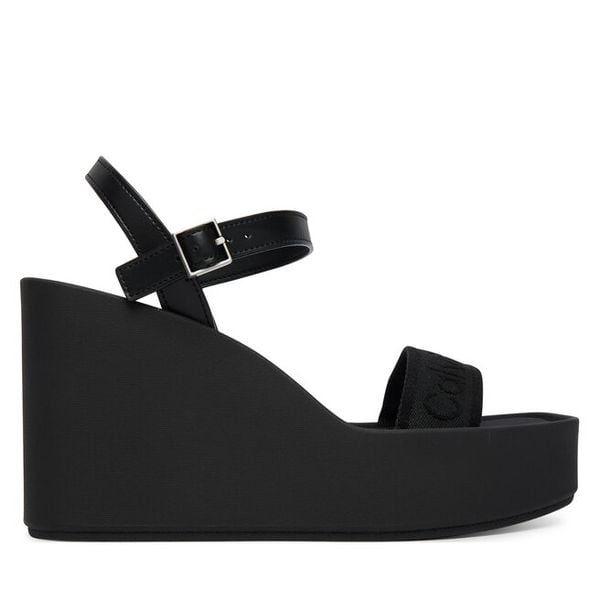 Sandały Calvin Klein. Czarne sandały damskie Calvin Klein, bez wzorów, bez obcasa, na koturnie, bez zapięcia. Za 265.99 zł.