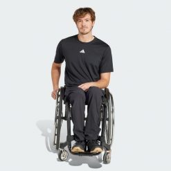 Spodnie Adaptive. Czarne spodnie sportowe męskie Adidas, m, bez wzorów, z materiału, na fitness i siłownię. W wyprzedaży za 164.50 zł.