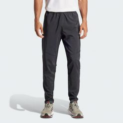 Spodnie Own The Run. Czarne spodnie sportowe męskie Adidas, xs, bez wzorów, z materiału, do biegania. Za 259.00 zł.