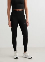 Damskie legginsy z wysokim stanem, odprowadzające pot Sculpting czarne. Czarne legginsy damskie Aim'n, bez wzorów, z lycry. Za 339.00 zł.