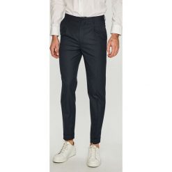 Jack & Jones - Spodnie. Niebieskie eleganckie spodnie męskie Jack & Jones, bez wzorów, z elastanu, eleganckie. W wyprzedaży za 99.90 zł.