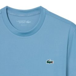 T-shirt Lacoste Core Performance Th. Niebieskie t-shirty damskie Lacoste, l, bez wzorów, z jersey, sportowe, bez kołnierzyka, bez ramiączek. Za 310.00 zł.