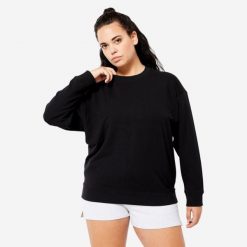 Bluza damska Domyos Gym & Pilates oversize. Czarne bluzy damskie DOMYOS, m, bez wzorów, z bawełny, sportowe, bez ramiączek, bez kaptura. Za 59.99 zł.