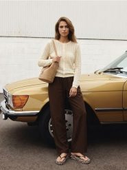 Bawełniany ażurowy kardigan - kremowy. Białe kardigany damskie Sinsay, l, w ażurowe wzory, z bawełny, bez kołnierzyka. Za 49.99 zł.