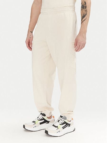 EA7 Emporio Armani Spodnie dresowe 7M000154 AF10432 U1079 Écru Regular Fit. Spodnie sportowe męskie EA7 Emporio Armani, l, bez wzorów, z bawełny. Za 279.99 zł.