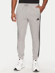 Adidas Spodnie dresowe Essential 3-Stripes JE6346 Szary Regular Fit. Szare spodnie sportowe męskie Adidas, l, bez wzorów, z bawełny. Za 149.99 zł.