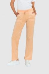 JUICY COUTURE Klasyczne welurowe spodnie dresowe del ray w brzoskwiniowym kolorze. Brązowe spodnie dresowe damskie Juicy Couture, bez wzorów, z dresówki, klasyczne. W wyprzedaży za 299.99 zł.