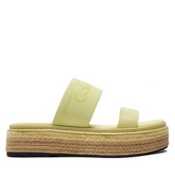 Klapki Calvin Klein. Żółte klapki damskie Calvin Klein, bez wzorów, bez obcasa, bez zapięcia. Za 649.99 zł.