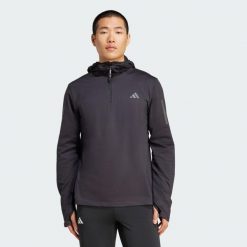 Bluza z kapturem Own The Run Winterized Hooded Half-Zip. Niebieskie bluzy męskie Adidas, l, bez wzorów, z kapturem, do biegania, ClimaWarm (Adidas). Za 279.00 zł.