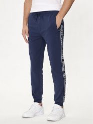 Guess Spodnie dresowe Z2YB19 K6ZS1 Granatowy Regular Fit. Niebieskie spodnie sportowe męskie Guess, m, z aplikacjami, z bawełny. Za 339.99 zł.