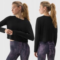 LONGSLEEVE DAMSKI 4F CROP-TOP DO JOG BLUZA Z DODATKIEM MODALU KOLOR CZARNY. Czarne bluzy damskie 4F, l, bez wzorów, z materiału, sportowe, bez ramiączek, bez kaptura. Za 79.99 zł.