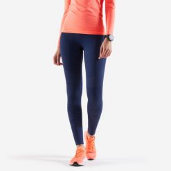 Legginsy do biegania damskie Kiprun Care. Niebieskie legginsy damskie KIPRUN, bez wzorów, z materiału. Za 89.99 zł.
