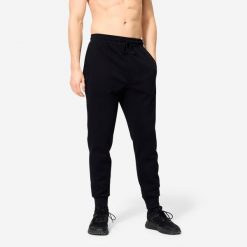 Spodnie fitness męskie Domyos Gym & Pilates slim. Niebieskie spodnie sportowe męskie DOMYOS, l, bez wzorów, z dresówki, na fitness i siłownię. Za 79.99 zł.