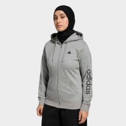 Bluza z kapturem damska ADIDAS fitness. Szare bluzy damskie Adidas, l, bez wzorów, z materiału, sportowe, bez ramiączek, z kapturem. Za 199.99 zł.