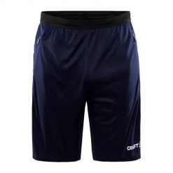 Spodenki treningowe męskie Craft Evolve Zip Pocket. Niebieskie spodnie materiałowe męskie Craft, bez wzorów, z dresówki. Za 239.00 zł.