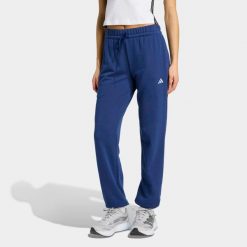 Spodnie fitness damskie ADIDAS. Niebieskie spodnie dresowe damskie Adidas, bez wzorów, z dresówki, sportowe, na fitness i siłownię. Za 199.99 zł.