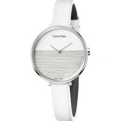 Calvin Klein Rise Zegarek Biały Srebrny. Białe zegarki damskie Calvin Klein, z materiału, srebrne. Za 917.95 zł.