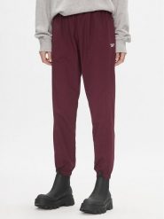 Reebok Spodnie dresowe Classics Franchise IL4627 Bordowy Relaxed Fit. Czerwone spodnie sportowe damskie Reebok, bez wzorów, z dresówki. Za 159.99 zł.
