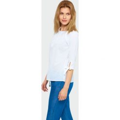 Bawełniana bluzka typu carmen. Bluzki damskie Greenpoint, bez wzorów, z bawełny, bez kołnierzyka, bez ramiączek. Za 39.99 zł.