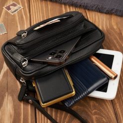 Paolo Peruzzi Saszetka męska do ręki skórzana czarna pojemna T-130-BL. Czarne saszetki i nerki męskie Paolo Peruzzi, bez wzorów. Za 178.58 zł.