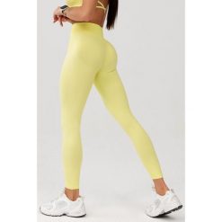 Damskie legginsy bezszwowe Rough Radical Seamless Glow Long. Żółte bielizna sportowa damska ROUGH RADICAL, bez wzorów. W wyprzedaży za 127.92 zł.