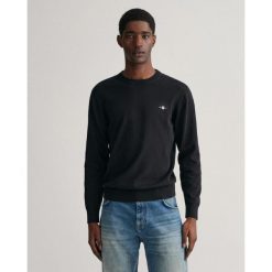 Sweter męski GANT z klasycznym okrągłym dekoltem. Czarne swetry męskie GANT, m, bez wzorów, z bawełny, eleganckie, bez kołnierzyka, bez ramiączek. Za 570.00 zł.