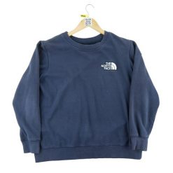 Sweter damski The North Face granatowy. Niebieskie swetry nierozpinane damskie The North Face, l, bez wzorów, z materiału, eleganckie, bez kołnierzyka, bez ramiączek. Za 106.46 zł.