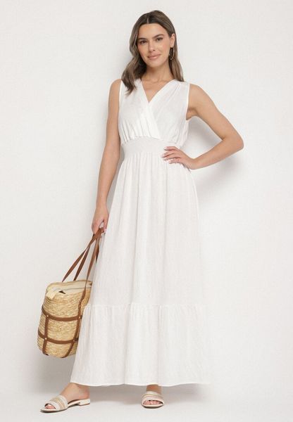 Biała Sukienka o Rozkloszowanym Kroju Bez Rękawów z Kopertowym Dekoltem Filoria. Białe sukienki damskie Born2be, na lato, l, bez wzorów, eleganckie, bez kołnierzyka, bez ramiączek, kopertowe. Za 79.99 zł.