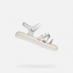 Sandały GEOX J SANDAL KODETTE GIR Biały. Białe sandały damskie Geox, bez wzorów, z syntetyku, bez obcasa, bez zapięcia. Za 241.99 zł.