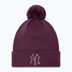 Czapka z daszkiem damska New Era Metallic Bobble Knit Beanie New York Yankees. Fioletowe czapki damskie New Era, na zimę, bez wzorów. Za 139.99 zł.