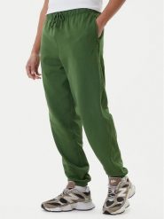 New Balance Spodnie dresowe MP41508 Zielony Relaxed Fit. Zielone spodnie sportowe męskie New Balance, m, bez wzorów, z bawełny. Za 359.99 zł.