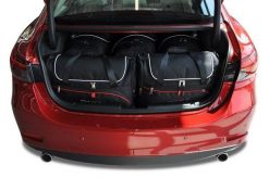 Torby Do Bagażnika Mazda 6 Limousine 2012-2024 5Szt Kjust. Czarne torby podróżne damskie KJUST, bez wzorów, z kauczuku. Za 1,624.00 zł.