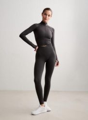 Damskie legginsy dłuższe, wysoki stan, invisible scrunch Shape Seamless szare. Szare legginsy damskie Aim'n, bez wzorów, z dzianiny. Za 300.00 zł.