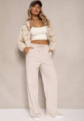 Beżowe Bawełniane Spodnie o Szerokim Kroju High Waist z Lampasami Pillorra. Brązowe spodnie materiałowe damskie Renee, bez wzorów, z bawełny, sportowe, z podwyższonym stanem. Za 109.99 zł.