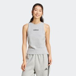 Koszulka bez rękawów damska ADIDAS Gym & Pilates. Koszulki sportowe damskie Adidas, bez wzorów, z bawełny, bez zapięcia, na fitness i siłownię. Za 89.99 zł.