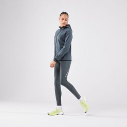 Legginsy do biegania damskie Kiprun Run 500 Warm ocieplane. Zielone legginsy damskie KIPRUN, bez wzorów, z elastanu. Za 129.99 zł.