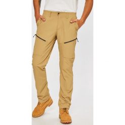 Salewa - Spodnie. Brązowe spodnie materiałowe męskie Salewa, bez wzorów, z materiału. W wyprzedaży za 179.90 zł.