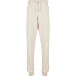 Spodnie dresowe dla kobiet Urban Classics Light Terry. Białe spodnie dresowe damskie Urban Classics, bez wzorów, z dresówki, sportowe, długie. Za 198.50 zł.