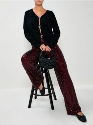 Sweter z kokardami - czarny. Czarne swetry nierozpinane damskie Sinsay, l, bez wzorów, bez kołnierzyka, bez ramiączek. Za 69.99 zł.