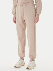Guess Spodnie dresowe V5BB23 KCX22 Beżowy Regular Fit. Brązowe spodnie dresowe damskie Guess, z aplikacjami, z dresówki. Za 479.99 zł.