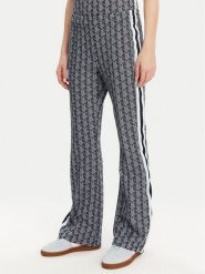 Lacoste Spodnie dresowe XF9313 Granatowy Regular Fit. Niebieskie spodnie dresowe damskie Lacoste, bez wzorów, z dresówki. Za 559.99 zł.