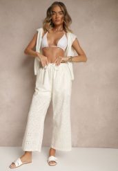 Jasnobeżowe Spodnie High Waist z Bawełnianej Tkaniny Zdobionej Haftem Mevirona. Brązowe spodnie materiałowe damskie Renee, z aplikacjami, z bawełny, eleganckie, z podwyższonym stanem. Za 44.99 zł.