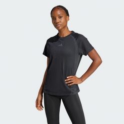 Bezszwowa koszulka z dzianiny. Czarne bluzki damskie Adidas, bez wzorów, z dzianiny, sportowe, bez kołnierzyka, bez ramiączek. Za 199.00 zł.