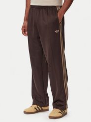 Adidas Spodnie dresowe adicolor Spacer KS7432 Brązowy ciemny Baggy Fit. Brązowe spodnie sportowe męskie Adidas, m, bez wzorów, z bawełny, trekkingowe. Za 348.99 zł.