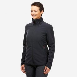 Kurtka turystyczna damska Softshell Forclaz MT100. Czarne kurtki sportowe damskie FORCLAZ, m, bez wzorów, z polaru, bez ramiączek, bez kaptura, trekkingowe. Za 199.99 zł.