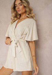 Beżowy Kopertowy Kombinezon z Bawełny Wiązany w Talii Materiałowym Paskiem Vikly. Brązowe sukienki damskie Renee, na co dzień, l, bez wzorów, z bawełny, eleganckie, bez kołnierzyka, bez ramiączek, kopertowe. Za 69.99 zł.