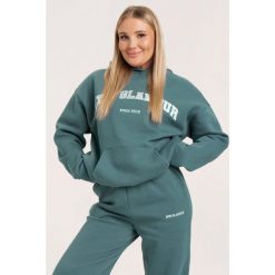 Bluza fitness damska Gym Glamour college. Niebieskie bluzy damskie GYM GLAMOUR, xl, bez wzorów, glamour, bez ramiączek, bez kaptura. Za 199.99 zł.