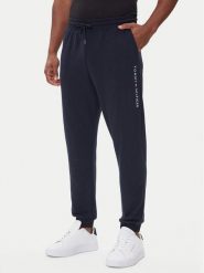 Tommy Hilfiger Spodnie dresowe UM0UM03664 Granatowy Regular Fit. Niebieskie spodnie sportowe męskie Tommy Hilfiger, l, bez wzorów, z bawełny. Za 269.99 zł.