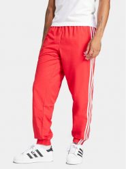 Adidas Spodnie dresowe Adicolor Woven Firebird IT2498 Czerwony Regular Fit. Czerwone spodnie sportowe męskie Adidas, m, bez wzorów, z dresówki. Za 219.99 zł.